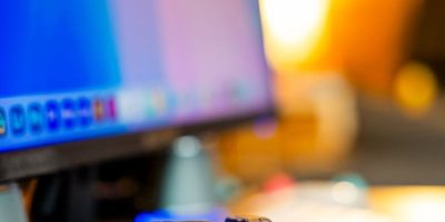 modern digital camera on wooden desk